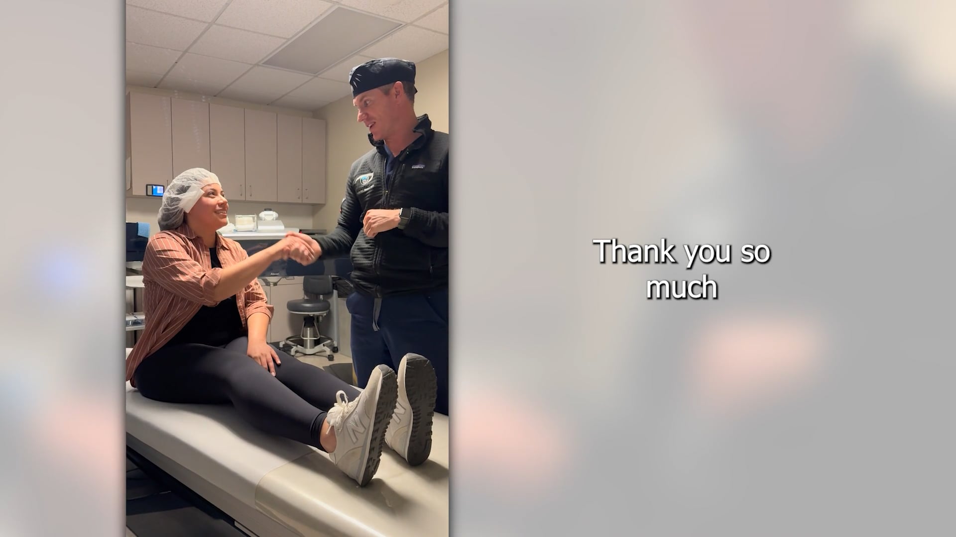 Dr. Nelson discussing painless LASIK surgery results with a happy patient in Vinings, GA.